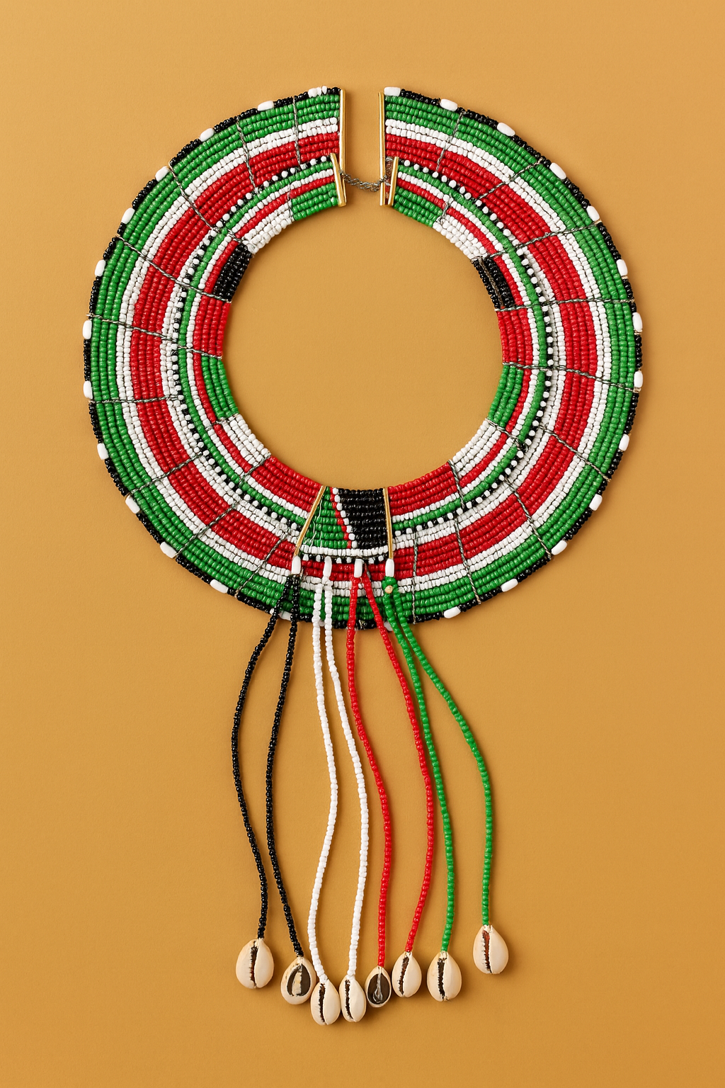 Traditional Pokot beaded necklace in red, green, black, and white with cowrie shells, displayed on a warm beige background.